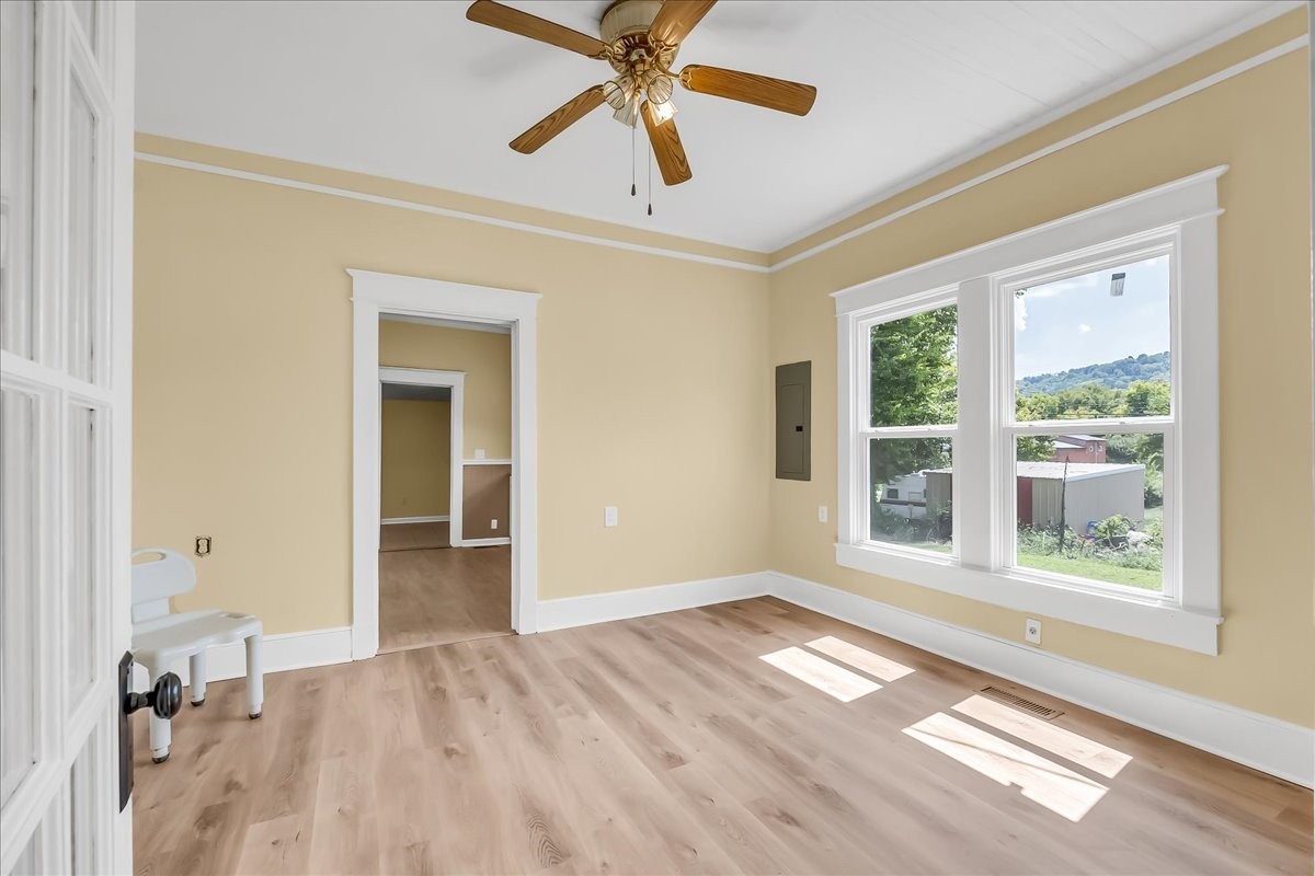 104 Locust Street Liberty, TN 37095 - Photo 9 of 57 a view of empty room with wooden floor and fan