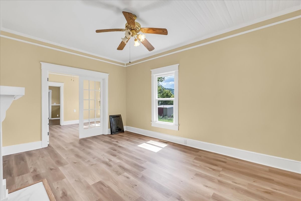 104 Locust Street Liberty, TN 37095 - Photo 10 of 57 a view of empty room with wooden floor and fan