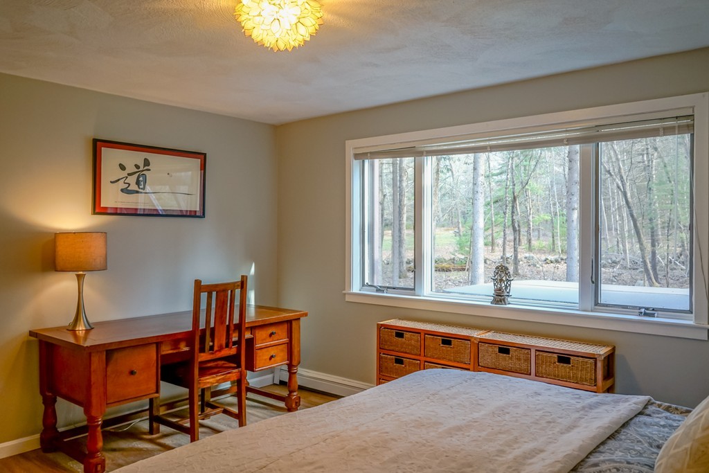 33 Sunset Road Carlisle, MA 01741 - Photo 12 of 27 a bedroom with furniture and a window