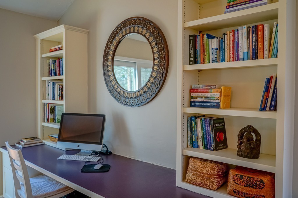 33 Sunset Road Carlisle, MA 01741 - Photo 17 of 27 a view of a workspace with furniture and a book shelf