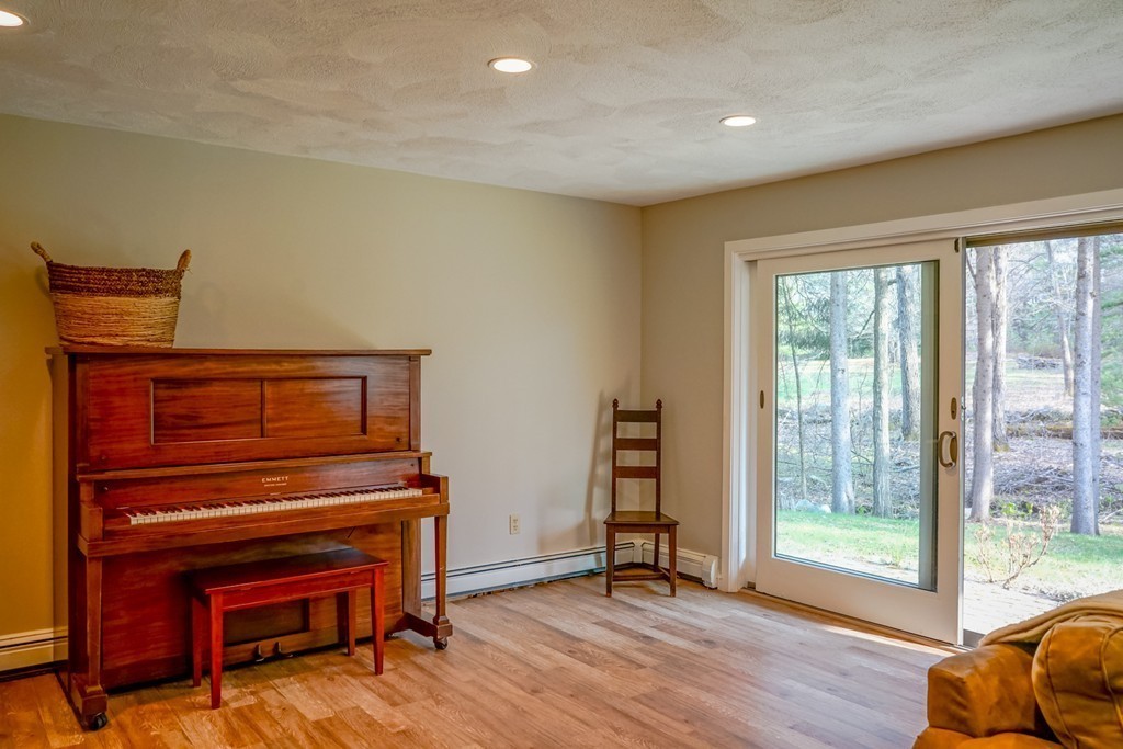 33 Sunset Road Carlisle, MA 01741 - Photo 18 of 27 a view of room with furniture and wooden floor