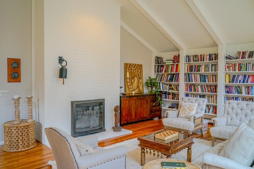 33 Sunset Road Carlisle, MA 01741 - Photo 4 of 27 a living room with furniture a rug and a book shelf