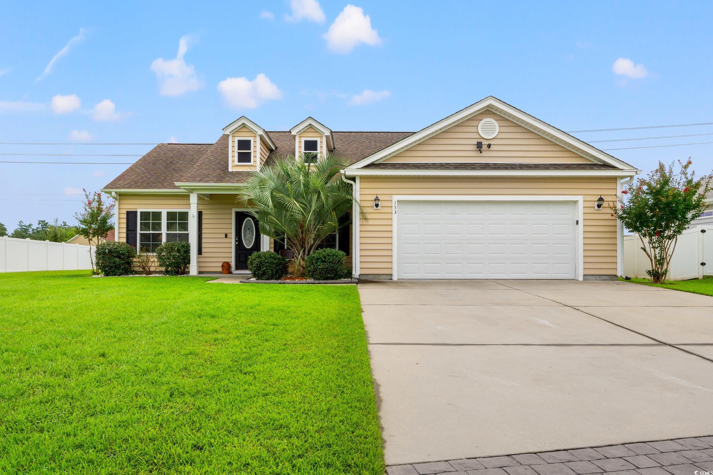 View of front of home with roof with shingles, concrete driveway, a porch, and an attached garage