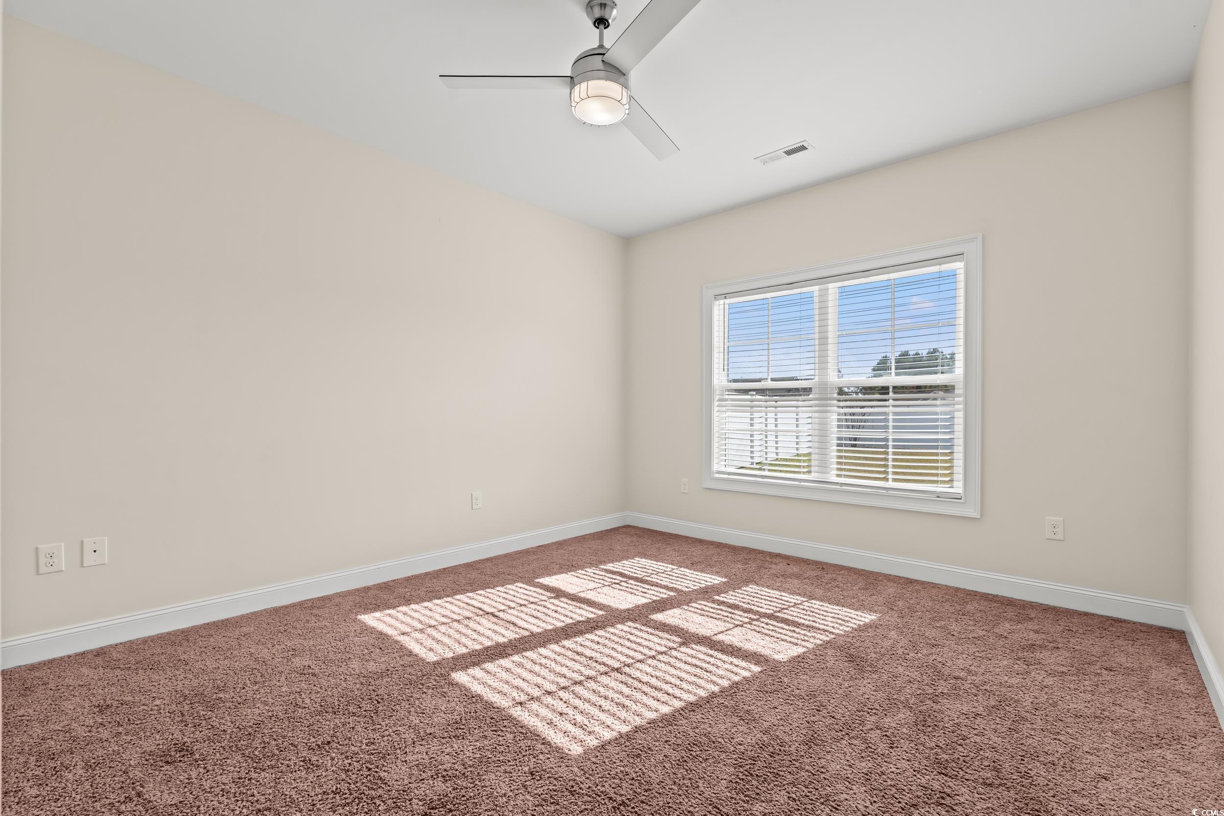 153 Grier Crossing Road Conway, SC 29526 - Photo 12 of 26 Carpeted spare room featuring baseboards and a ceiling fan