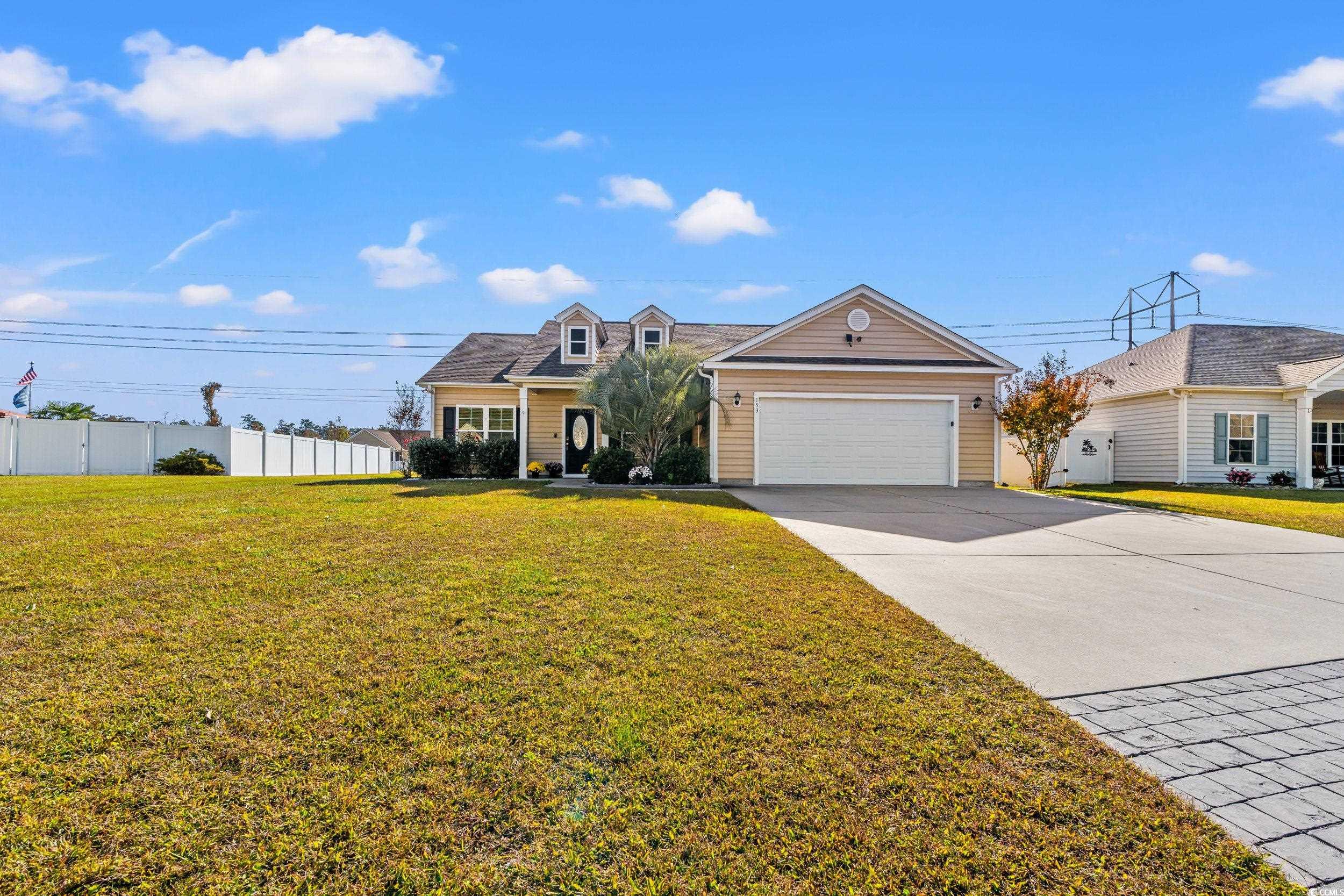 153 Grier Crossing Road Conway, SC 29526 - Photo 23 of 26 New england style home with driveway, a front lawn, and a garage