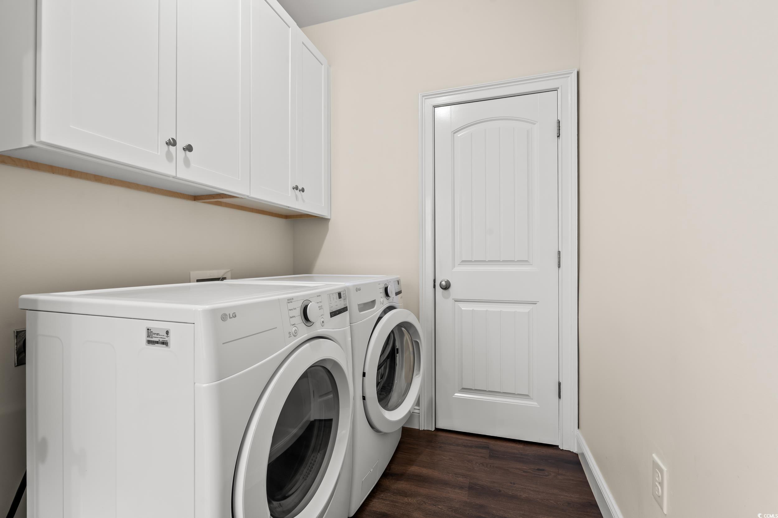 153 Grier Crossing Road Conway, SC 29526 - Photo 8 of 26 Laundry room featuring dark wood-style floors, independent washer and dryer, and cabinet space