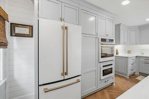 a kitchen with cabinets and appliances