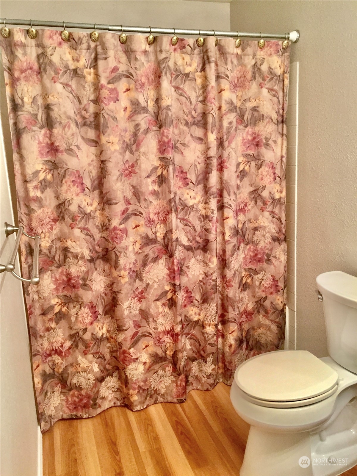 1800 Southwest 318th Place, Unit D Federal Way, WA 98023 - Photo 12 of 22 a white toilet sitting next to a shower curtain