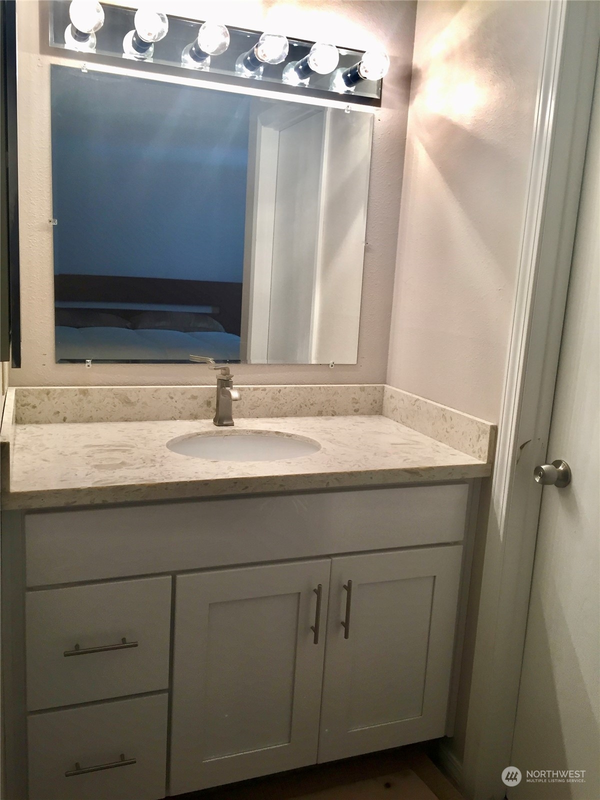 1800 Southwest 318th Place, Unit D Federal Way, WA 98023 - Photo 14 of 22 a close view of sink and mirror