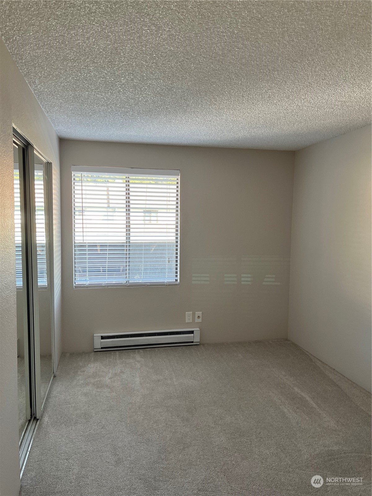 1800 Southwest 318th Place, Unit D Federal Way, WA 98023 - Photo 21 of 22 an empty room with wooden floor and windows