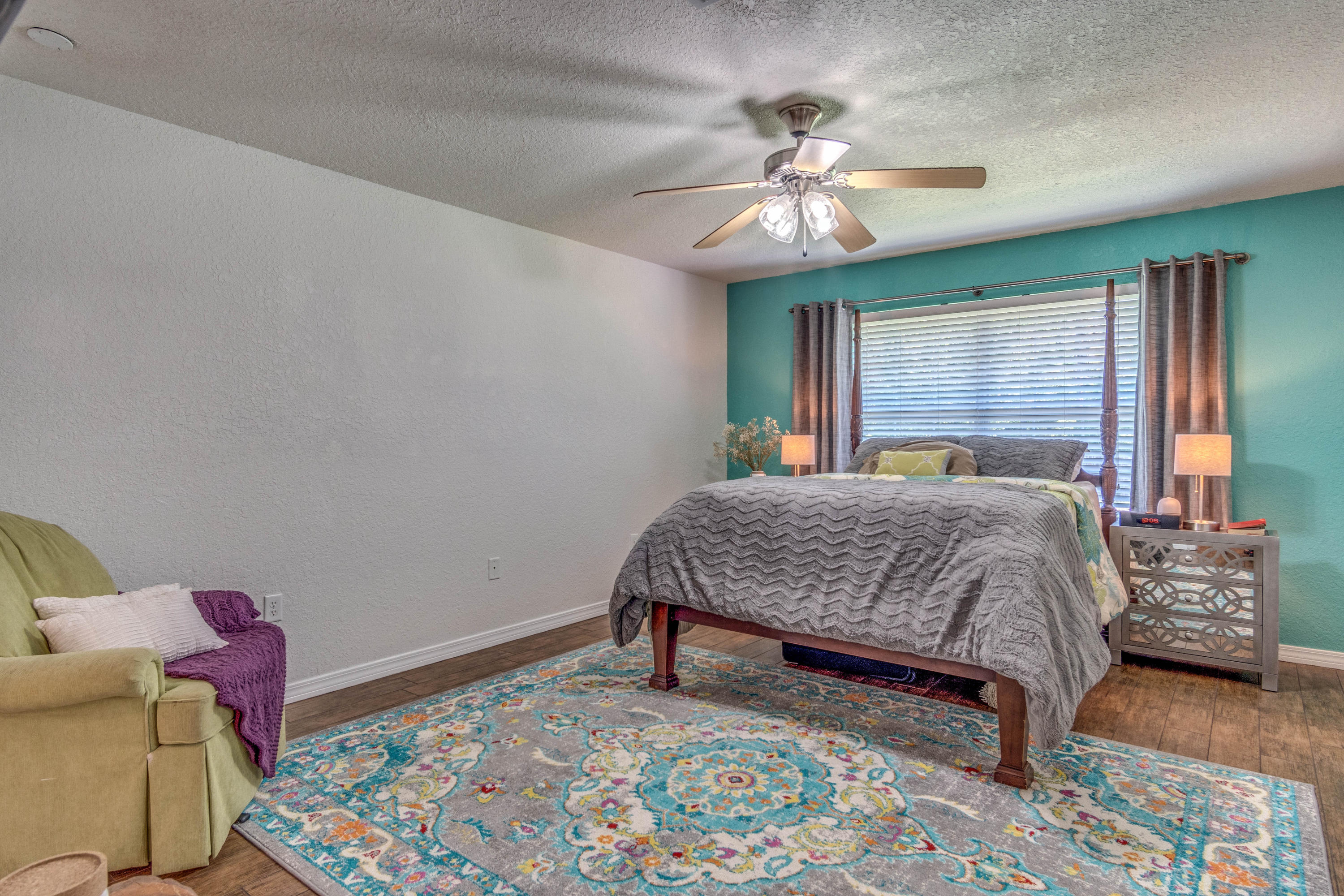 622 East Shipwreck Road Santa Rosa Beach, FL 32459 - Photo 11 of 39 a bedroom with a bed and a chandelier
