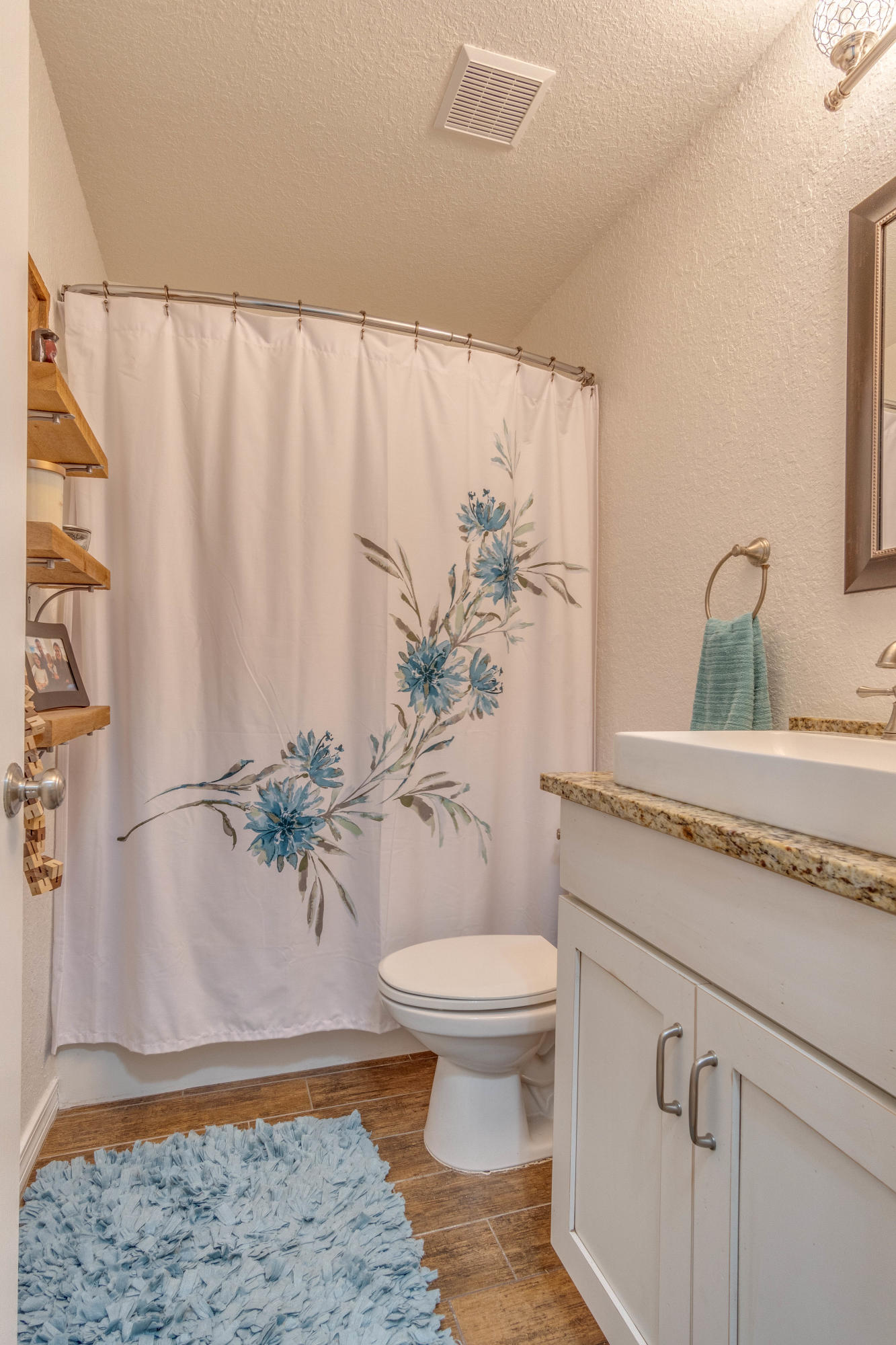 622 East Shipwreck Road Santa Rosa Beach, FL 32459 - Photo 16 of 39 a bathroom with a granite countertop sink toilet and a mirror