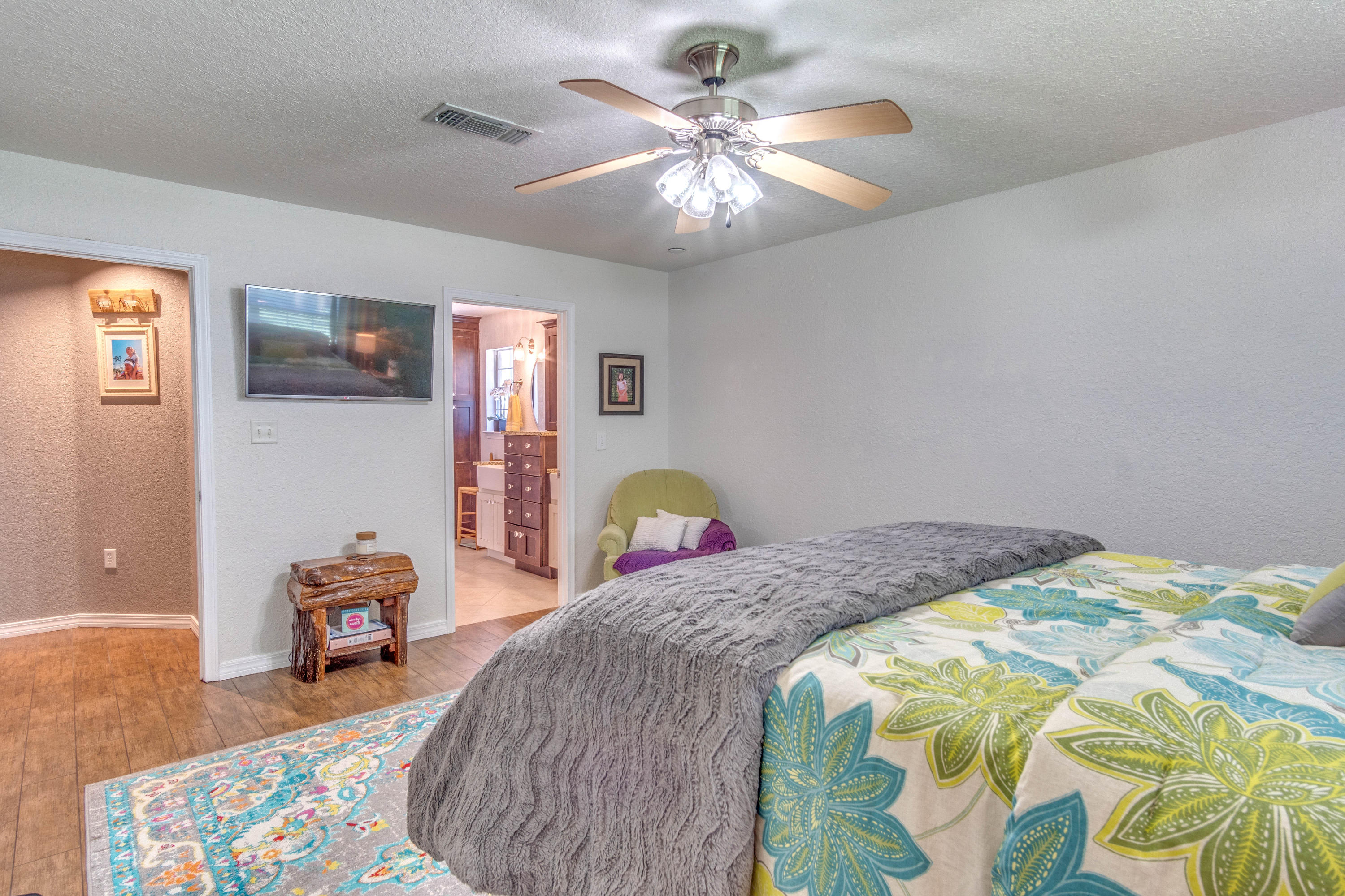 622 East Shipwreck Road Santa Rosa Beach, FL 32459 - Photo 23 of 39 a bedroom with a bed and a chandelier