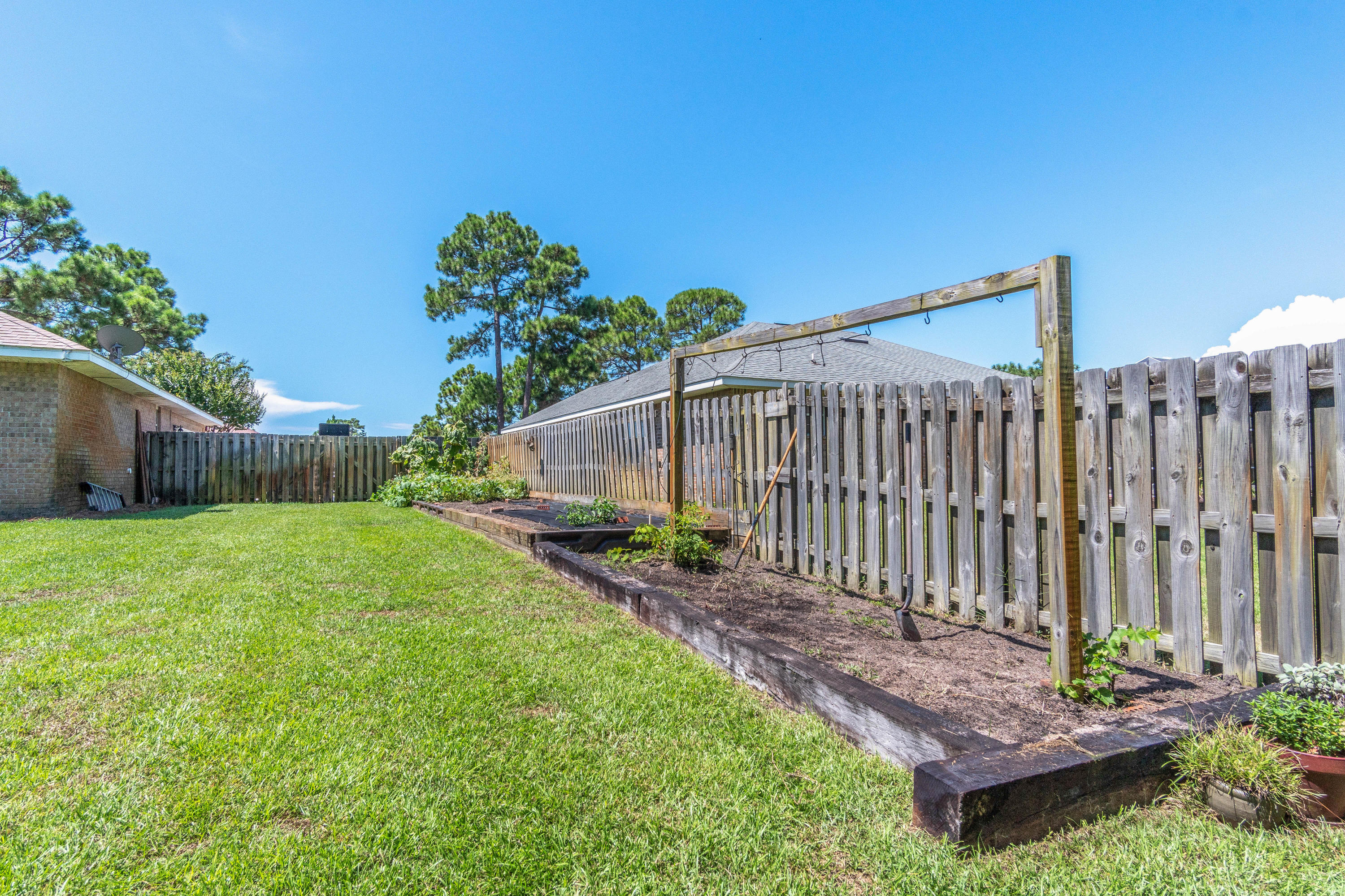 622 East Shipwreck Road Santa Rosa Beach, FL 32459 - Photo 26 of 39 a backyard of a house with lots of green space
