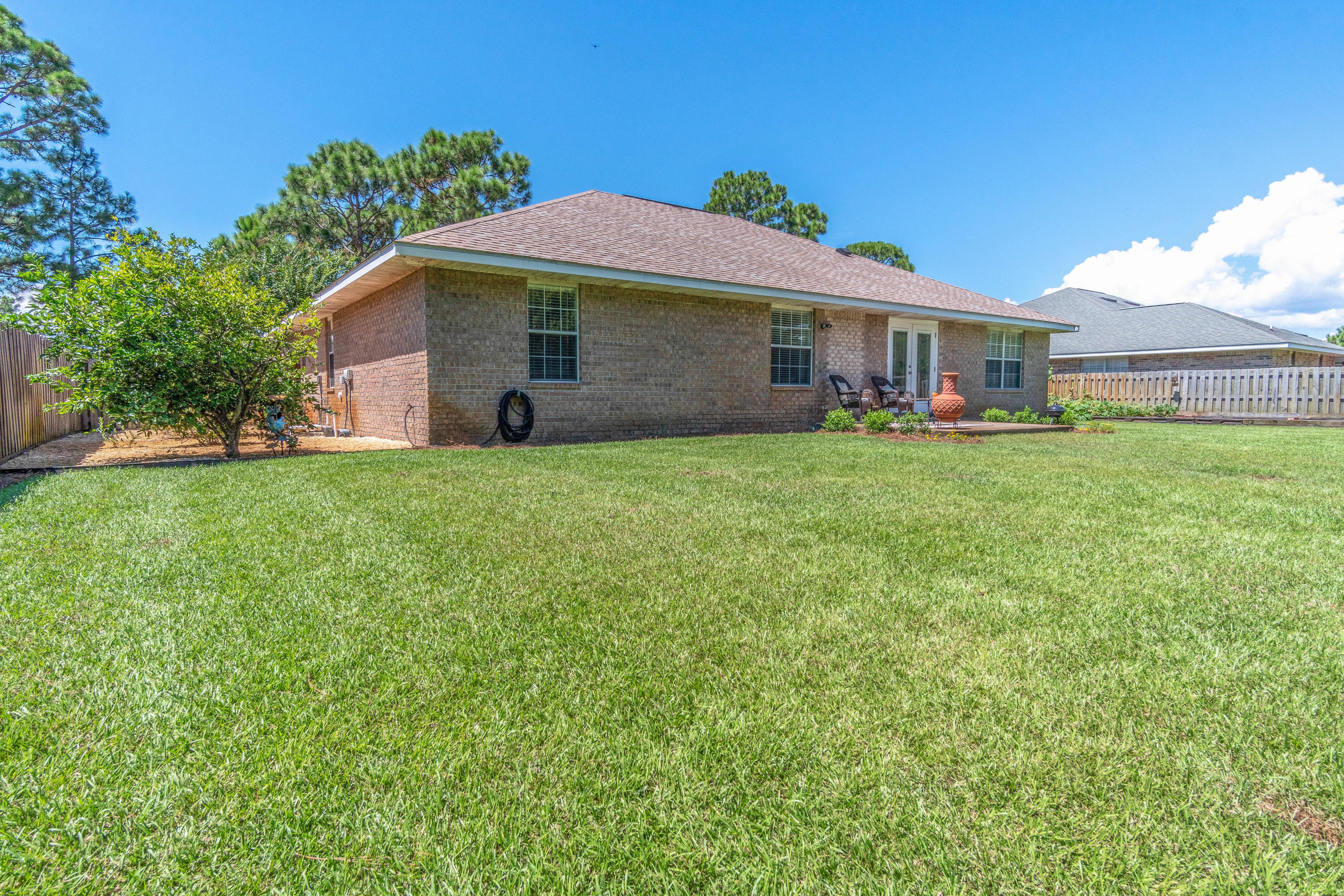 622 East Shipwreck Road Santa Rosa Beach, FL 32459 - Photo 27 of 39 a front view of a house with a garden