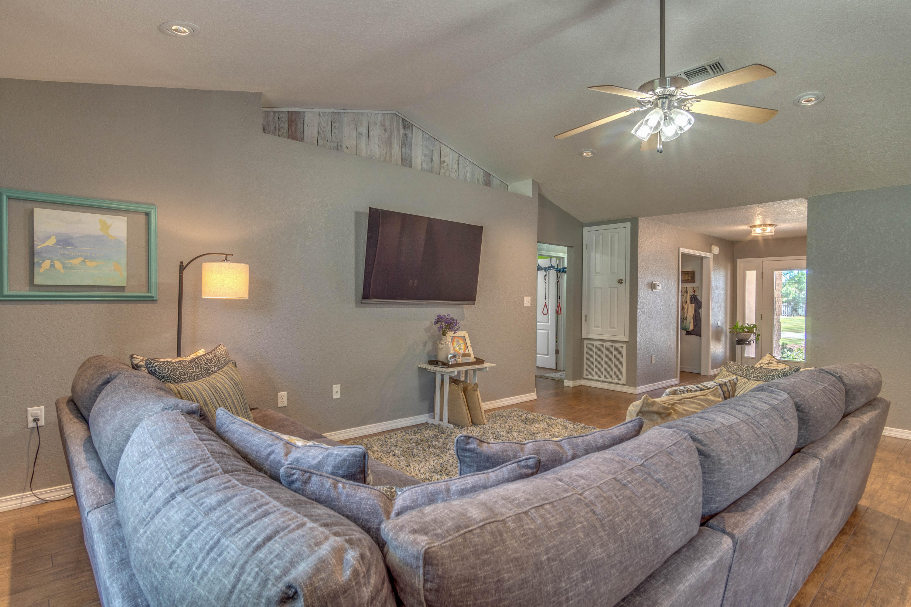 622 East Shipwreck Road Santa Rosa Beach, FL 32459 - Photo 4 of 39 a living room with furniture and a chandelier
