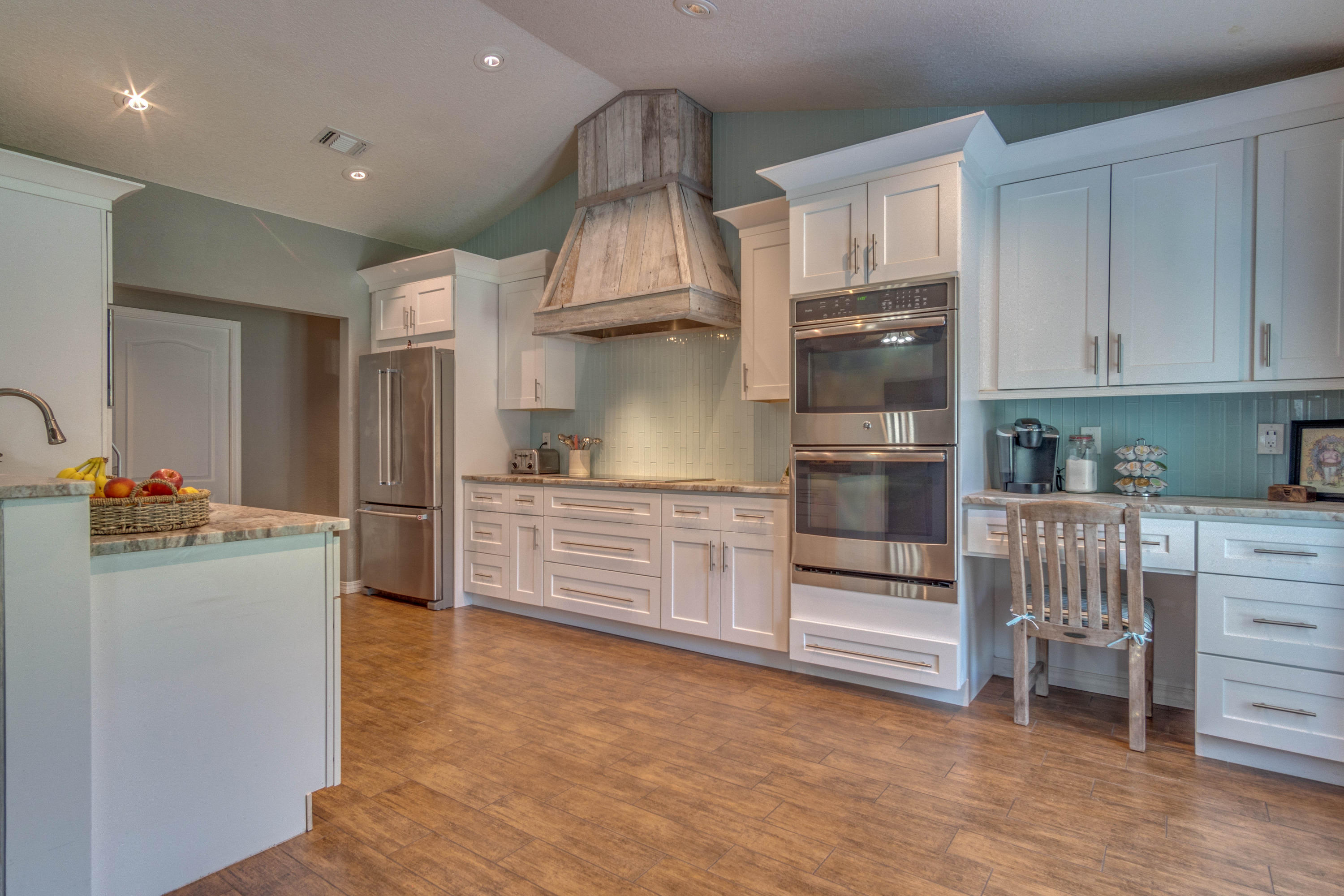 622 East Shipwreck Road Santa Rosa Beach, FL 32459 - Photo 6 of 39 a kitchen with stainless steel appliances a refrigerator and a stove top oven