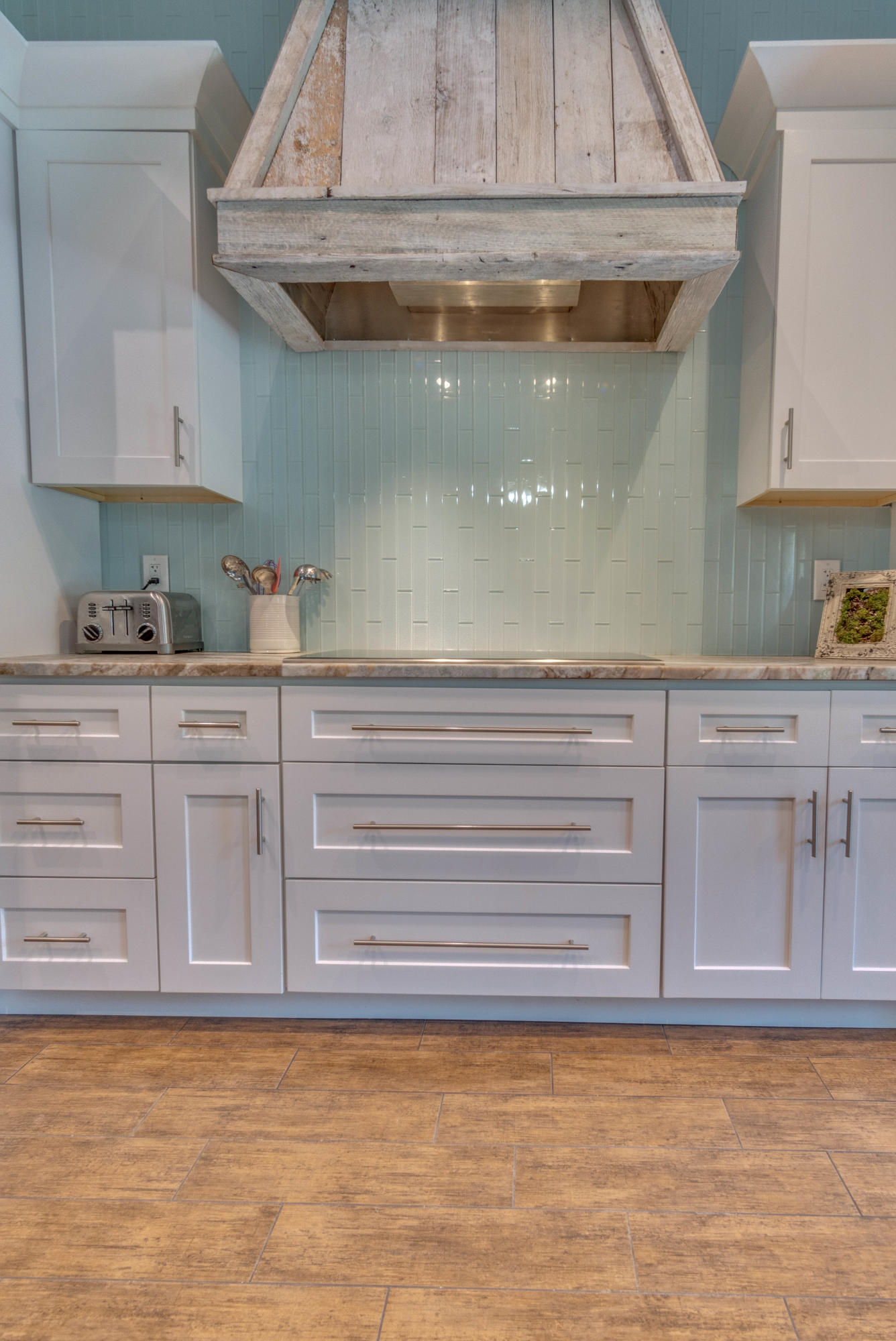 622 East Shipwreck Road Santa Rosa Beach, FL 32459 - Photo 7 of 39 a kitchen with a sink and cabinets