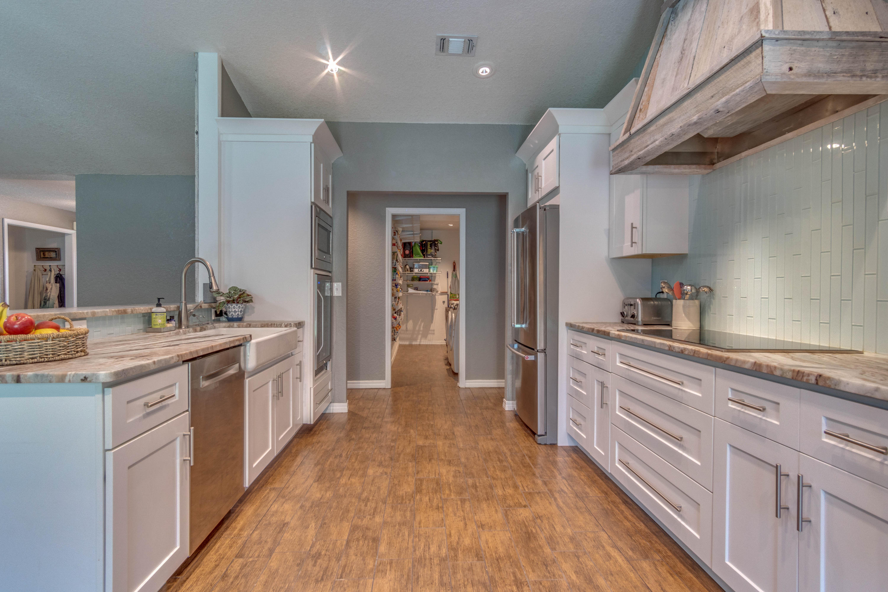 622 East Shipwreck Road Santa Rosa Beach, FL 32459 - Photo 10 of 39 a large kitchen with a lot of counter space and wooden floor