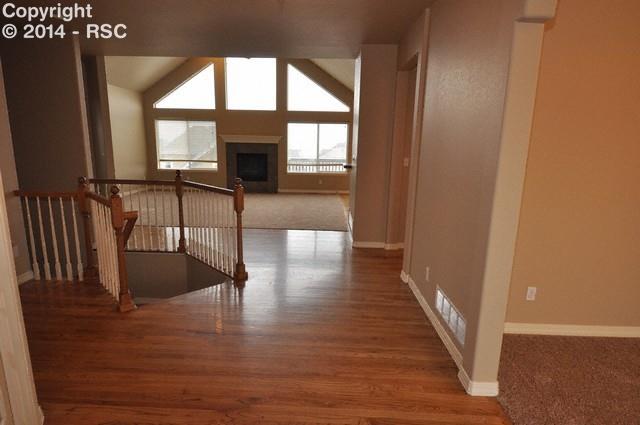 15892 Maple Hill Road Monument, CO 80132 - Photo 2 of 22 Hardwood floors in entry, kitchen, hallways and traffic areas