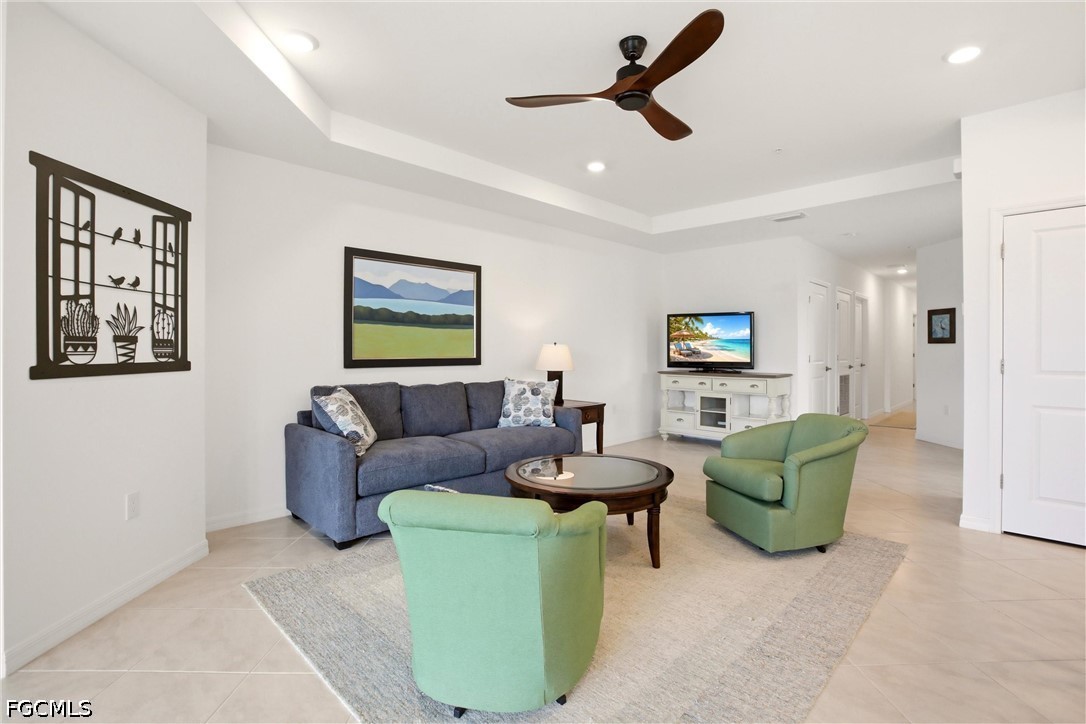 3751 Pebblebrook Ridge Court, Unit 101 Fort Myers, FL 33905 - Photo 13 of 48 a living room with furniture and a wooden floor