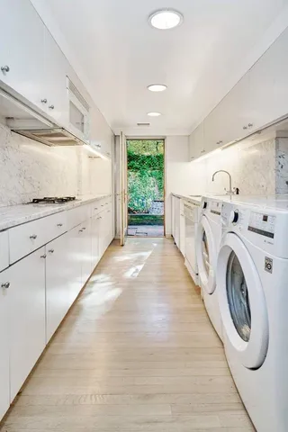 a view of a kitchen with washer and dryer