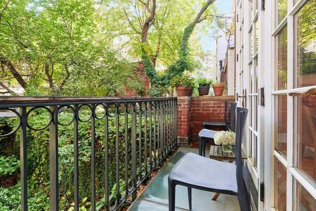 a view of a balcony with chairs