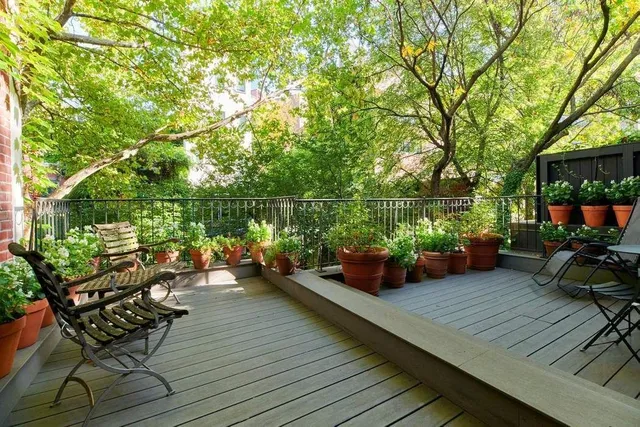 an outdoor living room with furniture