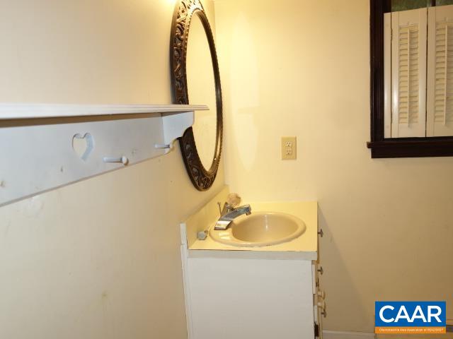 121 Rodes Valley Drive Nellysford, VA 22958 - Photo 12 of 23 a bathroom with a sink and a mirror