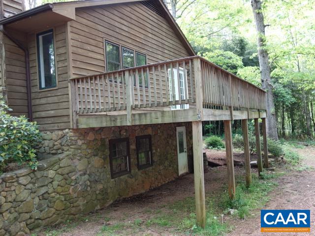 121 Rodes Valley Drive Nellysford, VA 22958 - Photo 23 of 23 a backyard of a house with table and chairs