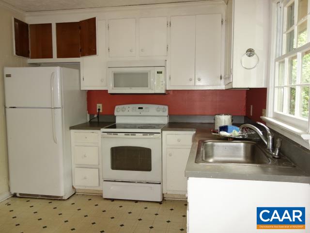121 Rodes Valley Drive Nellysford, VA 22958 - Photo 8 of 23 a kitchen with a sink a stove and cabinets