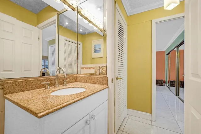 a bathroom with a sink a mirror and a shower