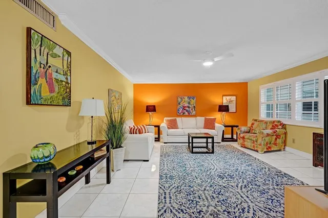 a living room with furniture and a table