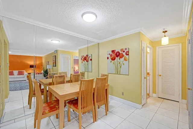 a large living room with a rug