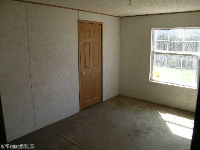 390 Henry Road Madison, NC 27025 - Photo 6 of 9 1st Bedroom.