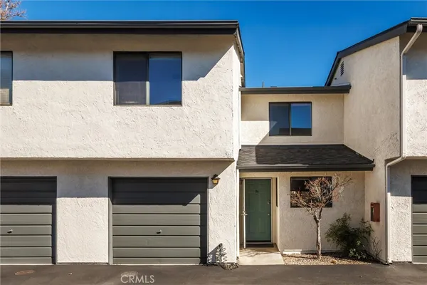 a front view of a house with garage