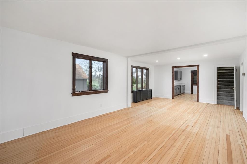 108 Buttercup Road Butler, PA 16001 - Photo 16 of 40 a view of an empty room with wooden floor and a window