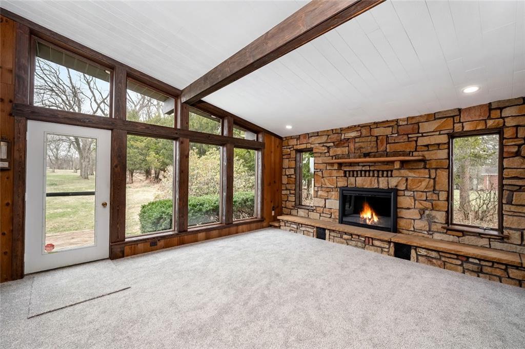 108 Buttercup Road Butler, PA 16001 - Photo 24 of 40 a view of an empty room with a fireplace and a window
