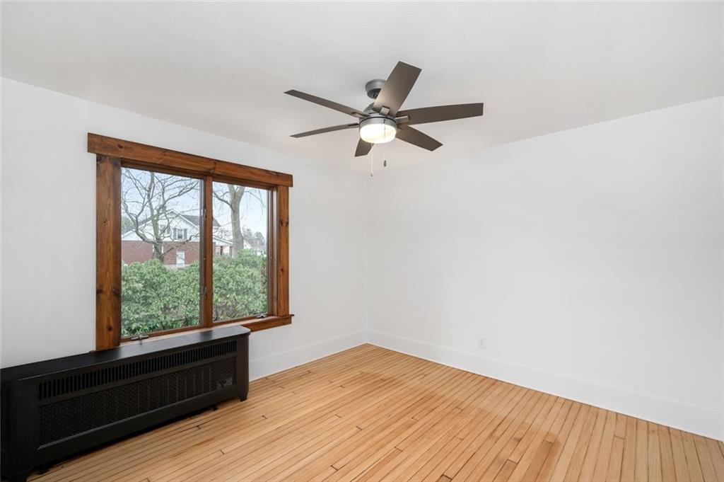 108 Buttercup Road Butler, PA 16001 - Photo 32 of 40 wooden floor in an empty room with a window