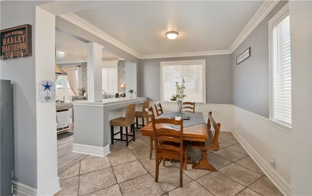 a view of a dining room with furniture and window