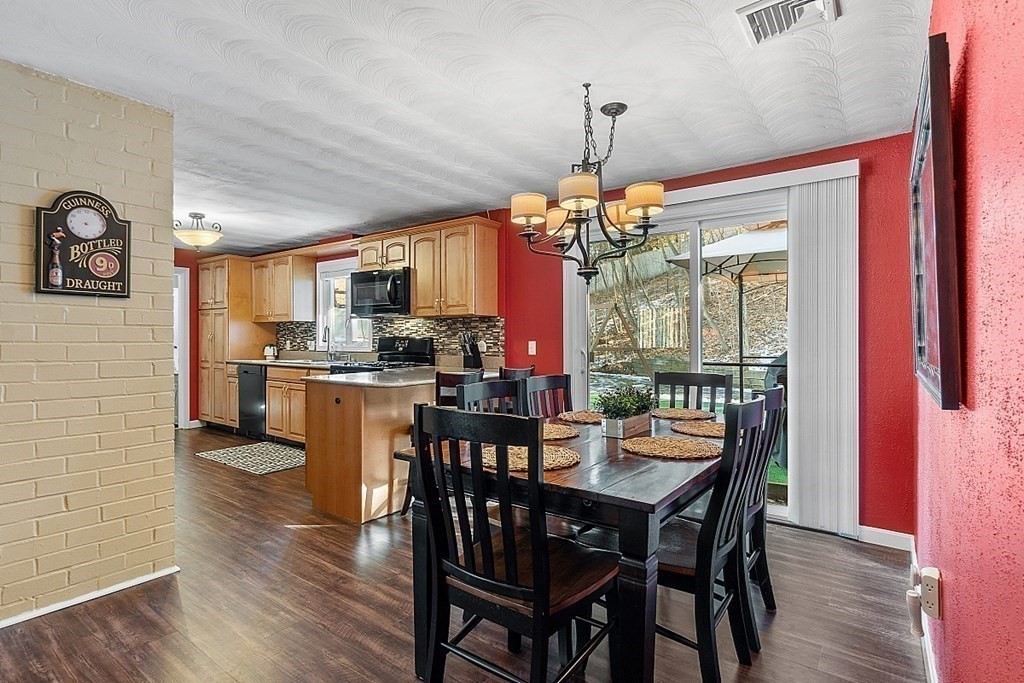 6 Nadine Road Chelmsford, MA 01824 - Photo 8 of 30 a view of a dining room with furniture window and wooden floor