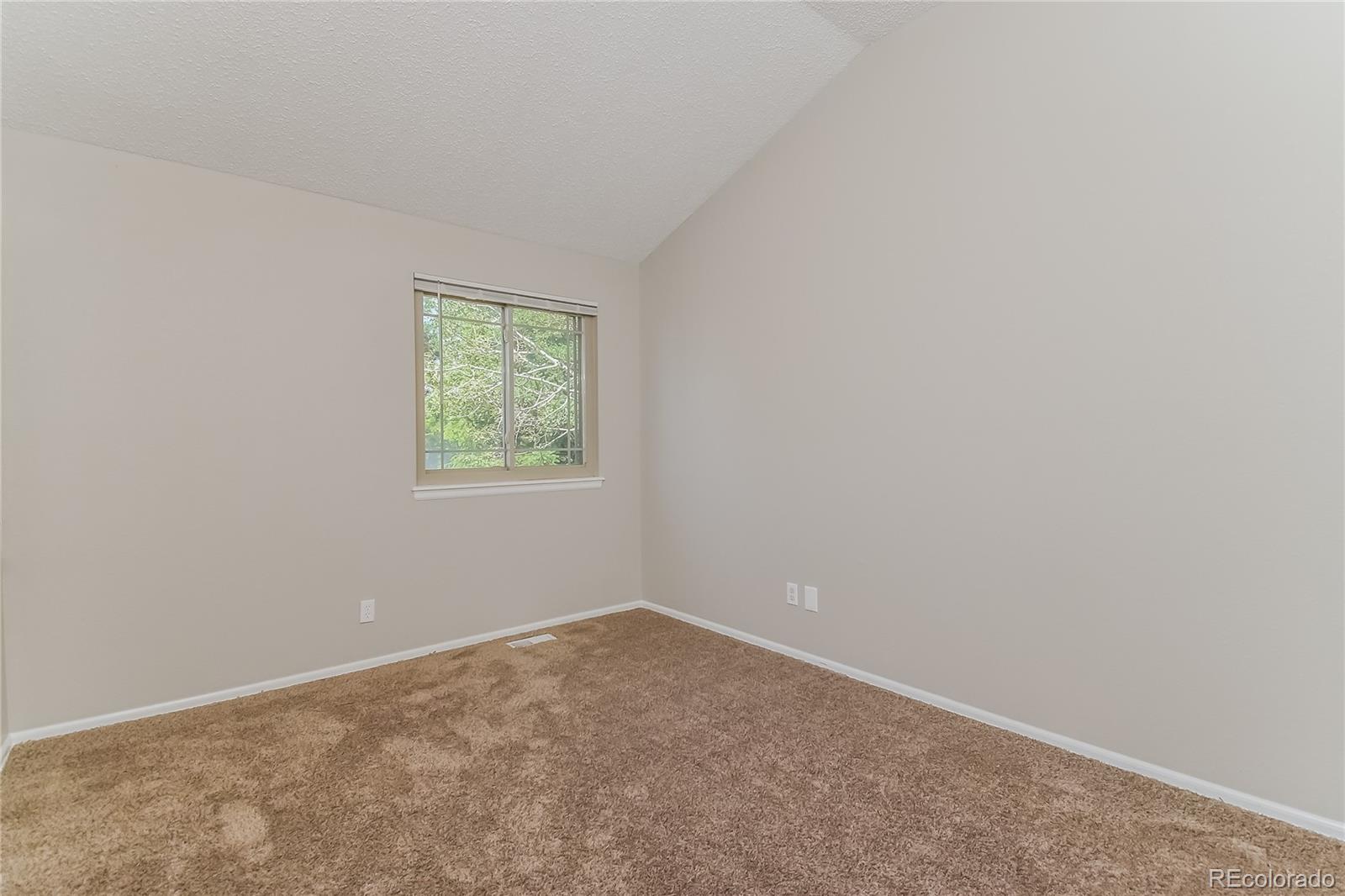 5245 Quasar Court Colorado Springs, CO 80917 - Photo 12 of 18 an empty room with a window
