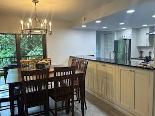 a view of a dining room with furniture window and outside view