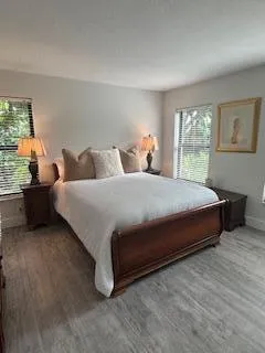 a bedroom with a bed and window