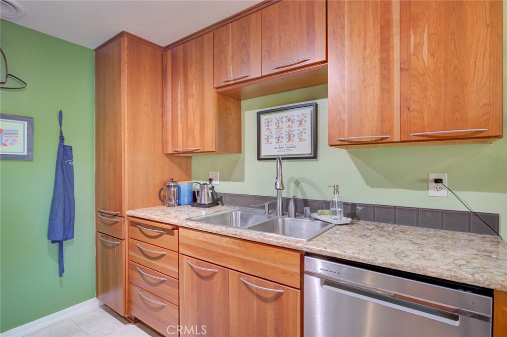 1750 Prefumo Canyon Road, Unit 48 San Luis Obispo, CA 93405 - Photo 12 of 32 a kitchen with sink and cabinets