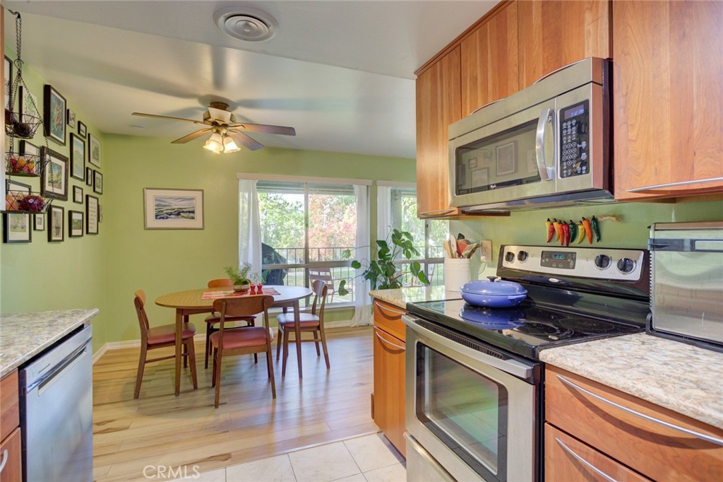 1750 Prefumo Canyon Road, Unit 48 San Luis Obispo, CA 93405 - Photo 13 of 32 a kitchen with a stove a sink and a microwave