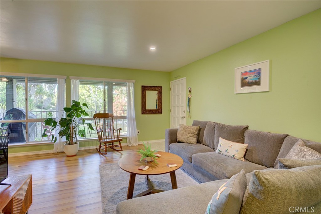1750 Prefumo Canyon Road, Unit 48 San Luis Obispo, CA 93405 - Photo 7 of 32 a living room with furniture and wooden floor
