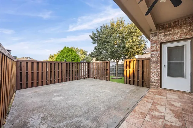 a view of a backyard of the house