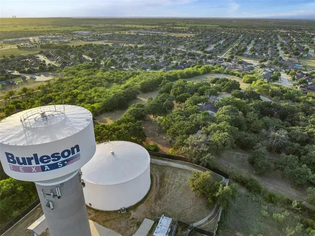 a view of a balcony with table and chairs