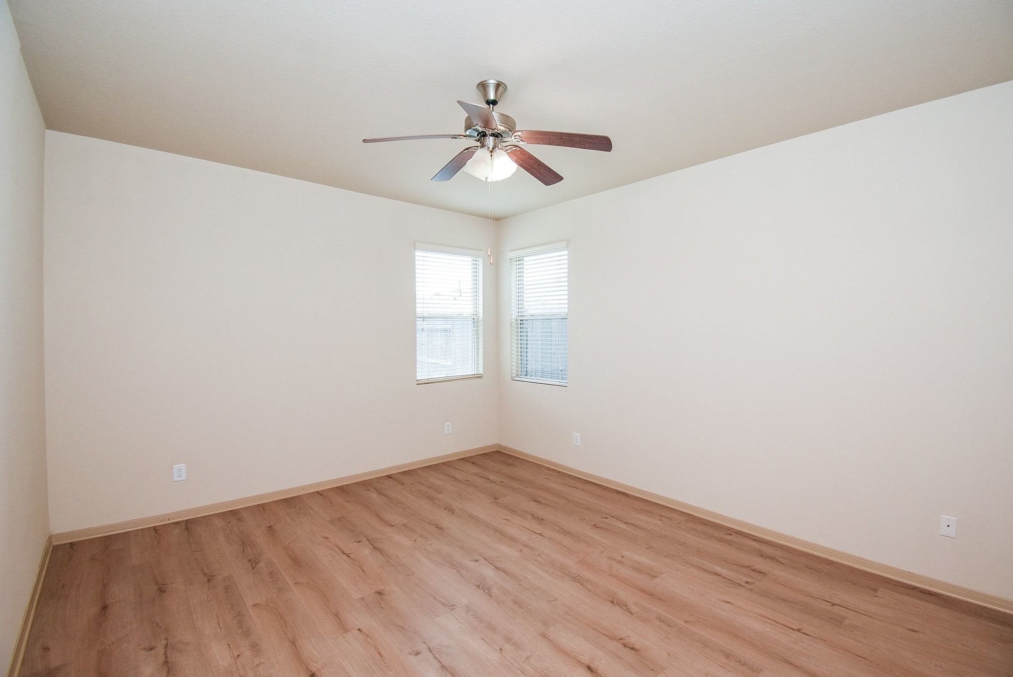2106 Harmon Crest Court Spring, TX 77373 - Photo 18 of 37 wooden floor in an empty room with a window